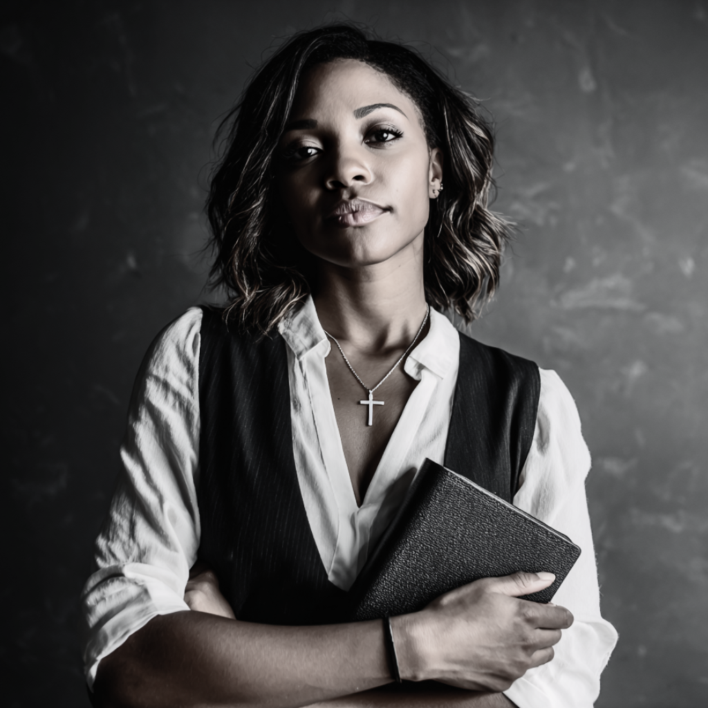 a beautiful woman holding a bible www.elevatehervault.com